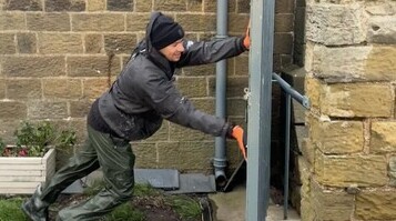 David Popa battling the elements in Whitby - strong winds