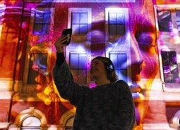 The unveiling of a specially commissioned AI artwork from Ouchhh Studio, made using cognitive technology to visualise brainwaves of the Arts & Film ‘Game Changers’ and projected across the façade of the V&A’s Exhibition Road Courtyard building in London, as part of The National Lottery’s 30th birthday celebrations.