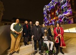 left-right Nandi Jola, Nikki Stratton, Marilyn Willrich, Sir Peter Murray, Berwyn Rowlands, Mark Brew, Adam Joolia and Gurinder Chadha attend the unveiling of a specially commissioned AI artwork from Ouchhh Studio, made using cognitive technology to visualise brainwaves of the Arts & Film ‘Game Changers’ and projected across the façade of the V&A’s Exhibition Road Courtyard building in London, as part of The National Lottery’s 30th birthday celebrations. 