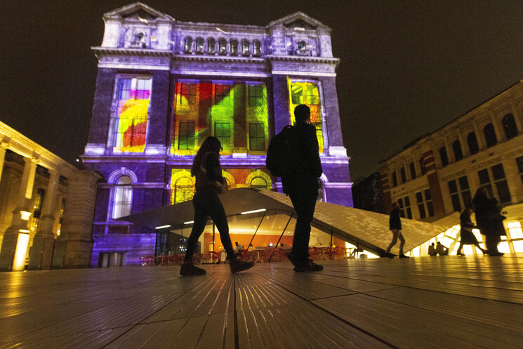 The unveiling of a specially commissioned AI artwork from Ouchhh Studio, made using cognitive technology to visualise brainwaves of the Arts & Film ‘Game Changers’ and projected across the façade of the V&A’s Exhibition Road Courtyard building in London, as part of The National Lottery’s 30th birthday celebrations. 