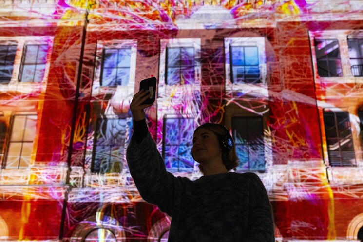 The unveiling of a specially commissioned AI artwork from Ouchhh Studio, made using cognitive technology to visualise brainwaves of the Arts & Film ‘Game Changers’ and projected across the façade of the V&A’s Exhibition Road Courtyard building in London, as part of The National Lottery’s 30th birthday celebrations. 