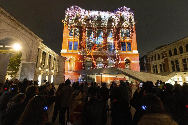 The unveiling of a specially commissioned AI artwork from Ouchhh Studio, made using cognitive technology to visualise brainwaves of the Arts & Film ‘Game Changers’ and projected across the façade of the V&A’s Exhibition Road Courtyard building in London, as part of The National Lottery’s 30th birthday celebrations. 