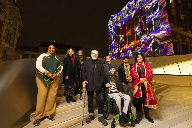 left-right Nandi Jola, Nikki Stratton, Marilyn Willrich, Sir Peter Murray, Berwyn Rowlands, Mark Brew, Adam Joolia and Gurinder Chadha attend the unveiling of a specially commissioned AI artwork from Ouchhh Studio, made using cognitive technology to visualise brainwaves of the Arts & Film ‘Game Changers’ and projected across the façade of the V&A’s Exhibition Road Courtyard building in London, as part of The National Lottery’s 30th birthday celebrations. 