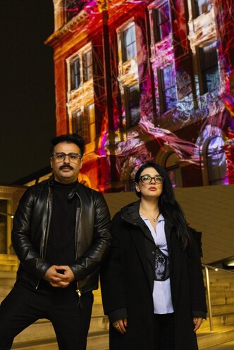 left-right artist Ferdi Alici and Eylul Alici, of OUCHHH, unveil a specially commissioned AI artwork made using cognitive technology to visualise brainwaves of the Arts & Film ‘Game Changers’ and projected across the façade of the V&A’s Exhibition Road Courtyard building in London, as part of The National Lottery’s 30th birthday celebrations.